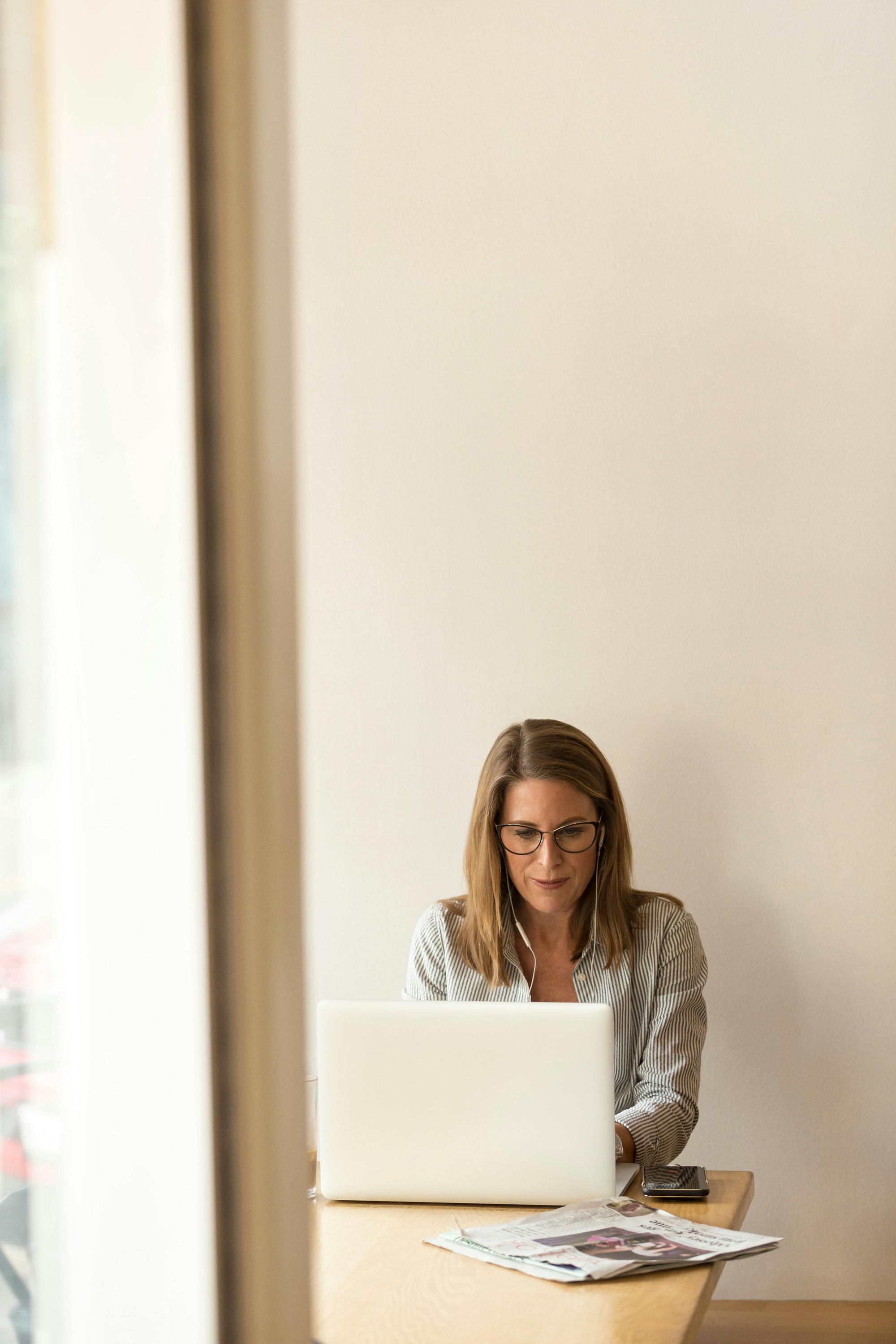 Senior woman focused on laptop work
